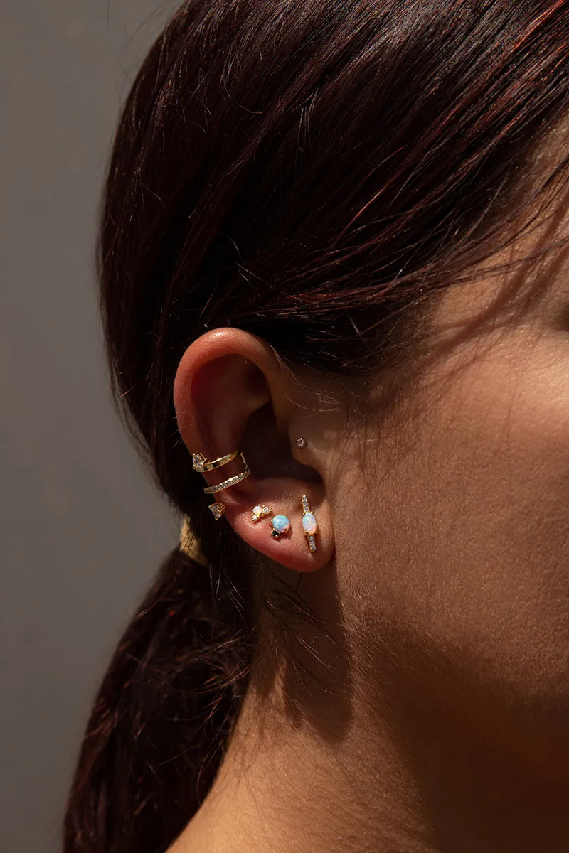 Piercing de plata bao dorado ópalo central y circonitas